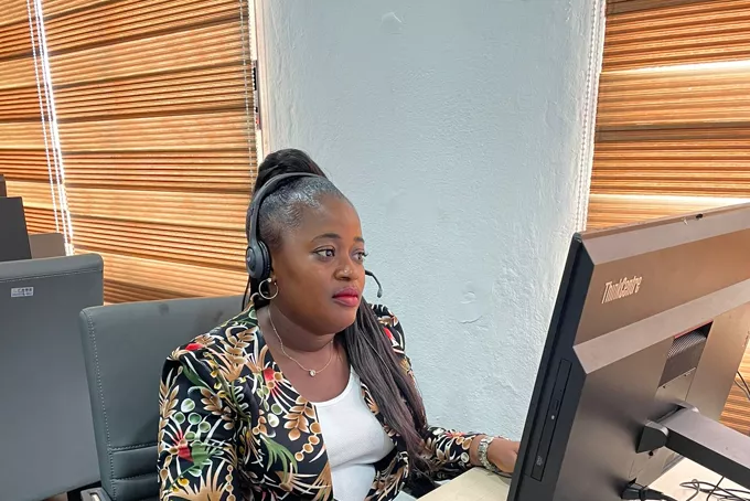 A Kappagee support operator working at her station.