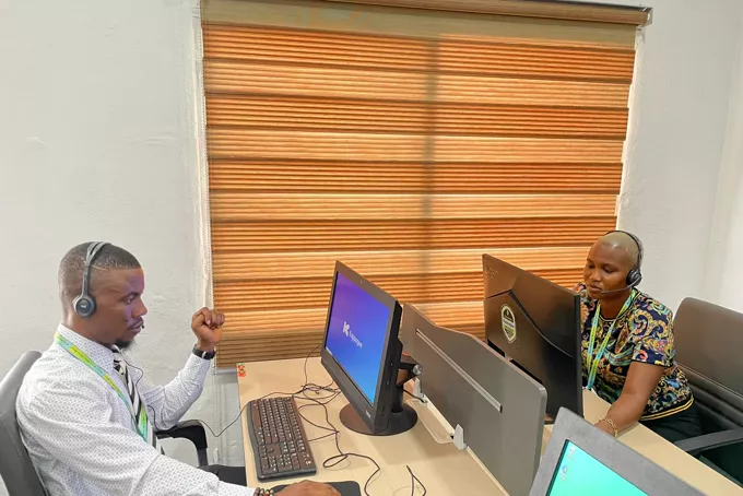 Two Kappagee support operators at their workstations.