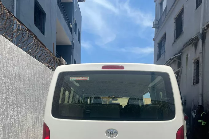 A passenger van on a customer’s yard.