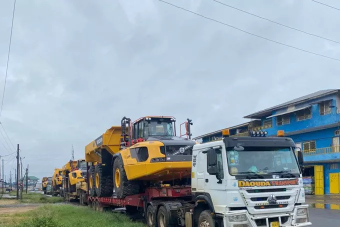 Heavy plant loaded on low-loaders, ready to move to site.