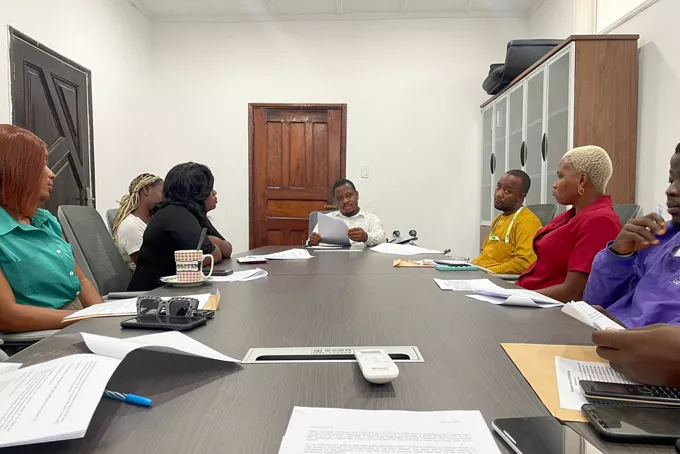 A fleet review meeting around a boardroom table.